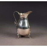 GEORGE V PLAIN SILVER CREAM JUG, of pyriform with shaped rim, scroll handle and shell capped