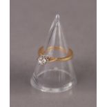 18ct GOLD RING WITH A ROUND BRILLIANT CUT SOLITAIRE DIAMOND, in a six claw setting, approximately