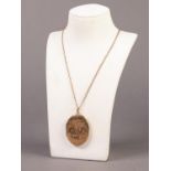 9ct GOLD CHAIN NECKLACE, 2.6 gms and engraved oval LOCKET PENDANT with 9ct gold back and front