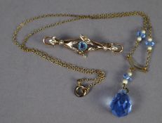 9ct GOLD OPENWORK BROOCH with a grain set blue stone and seed pearls, Birmingham 1911 and a