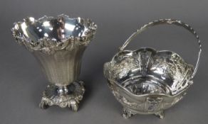 A COLONIAL WHITE METAL SUGAR BASKET WITH SWING HANDLE, the bowl pierced and chased with four