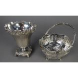 A COLONIAL WHITE METAL SUGAR BASKET WITH SWING HANDLE, the bowl pierced and chased with four