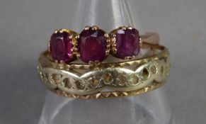 9ct GOLD RING set with three oval amethysts and a 9ct GOLD ETERNITY RING set with tiny white stones,