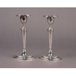EDWARD VII PAIR OF WEIGHTED SILVER CANDLESTICKS, each of slender oval form with removable sconce and