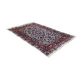 BOLD, MULTI-COLOURED GOREVAN, PERSIAN, CARPET, witht concentric lozenge shaped centre medallions, on