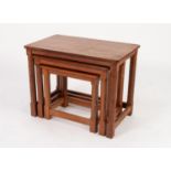 MOUSEMAN THOMPSON NEST OF THREE OAK TABLES with adzed tops and polygonal chamfered legs with