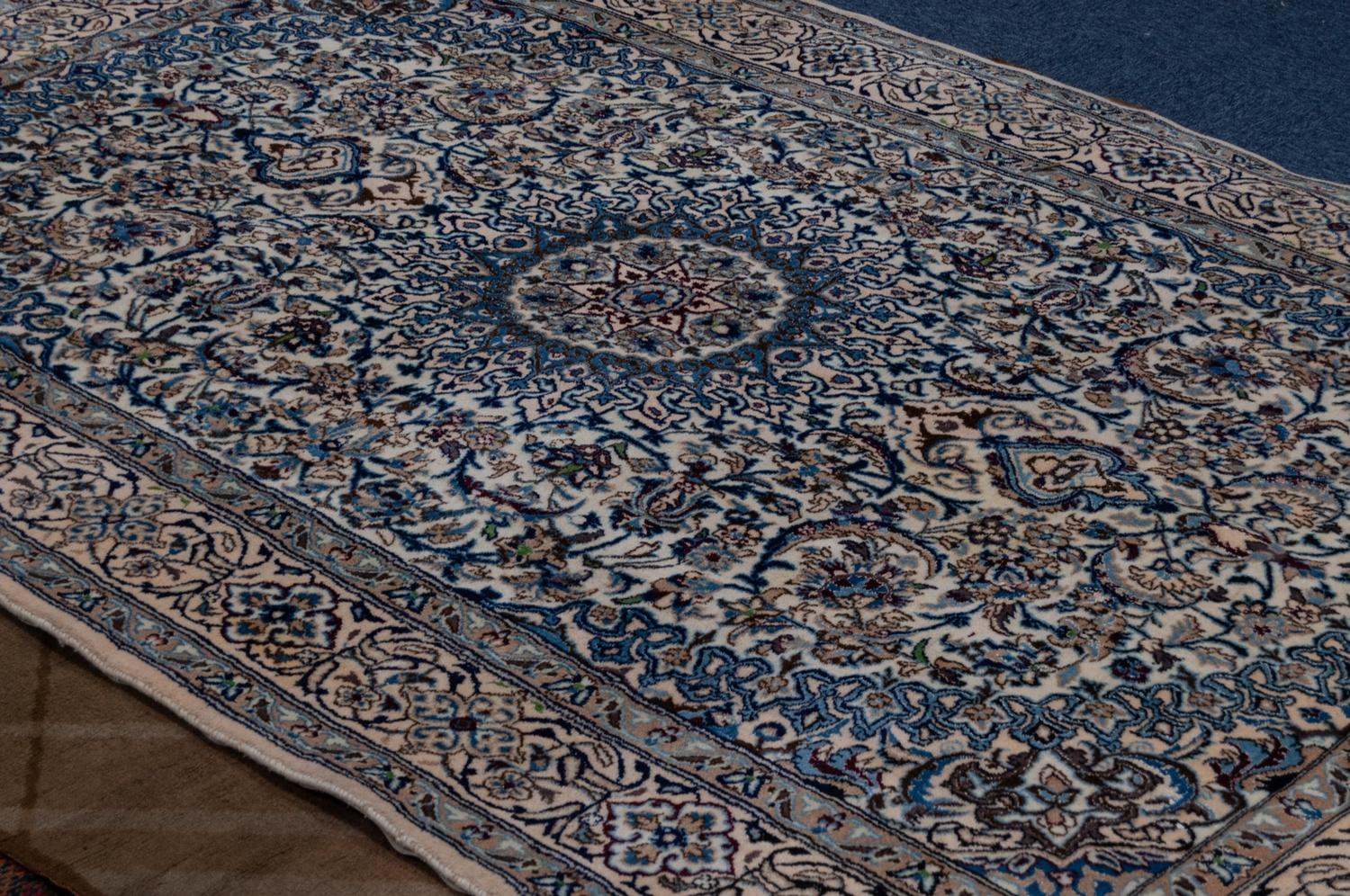 GOREVAN, PERSIAN CARPET with circular concentric medallions with long pendants, on a white field - Image 2 of 2