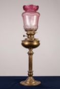 ART NOUVEAU EMBOSSED OIL TABLE LAMP with fluted column, floral embossed spreading foot, clear