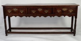 LATE EIGHTEENTH CENTURY OAK DRESSER, the moulded slender oblong top above three cockbeaded frieze