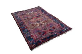 SHIRAZ PERSIAN RUG, with stylised cloud band and rams horn ladder pattern in alternate red and