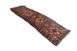 SHIRAZ PERSIAN RUNNER with eight splash pattern medallions in blue and fawn on a wine red and floral