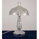 MODERN CUT GLASS ELECTRIC TABLE LAMP, the slender baluster shaped column set beneath a domed shade