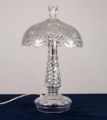 MODERN CUT GLASS ELECTRIC TABLE LAMP, the slender baluster shaped column set beneath a domed shade