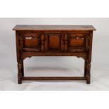 JACOBEAN STYLE MODERN REPRODUCTION DISTRESSED OAK SMALL DRESSER, the oblong top above a central