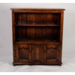 JACOBEAN STYLE MODERN REPRODUCTION DISTRESSED OAK OPEN BOOKCASE, the moulded oblong top above a