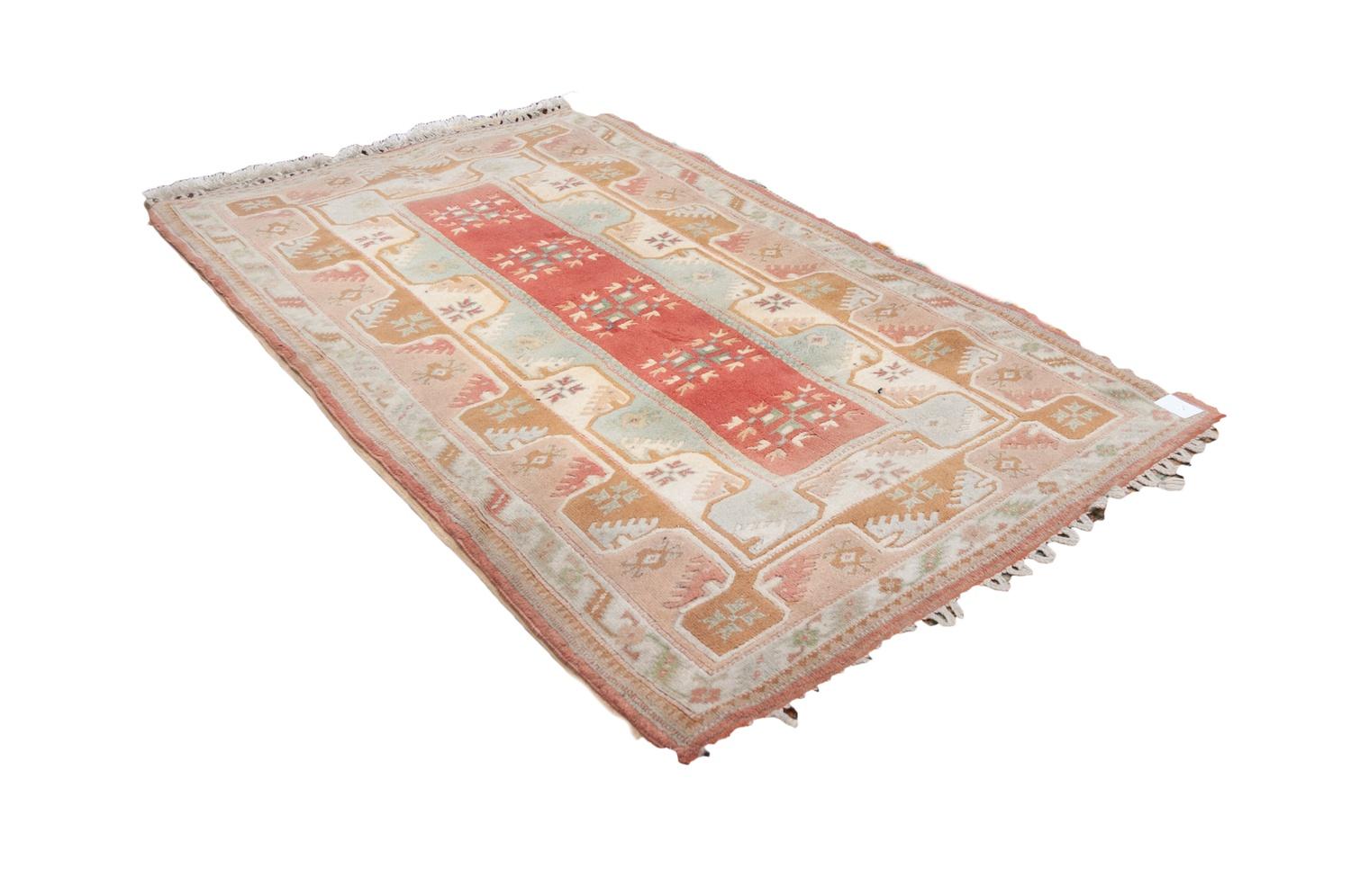 TURKISH LARGE ALL-WOOL EMBOSSED RUG, with a narrow salmon pink central panel with five square repeat