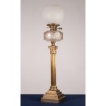 EARLY TWENTIETH CENTURY BRASS CORINTHIAN COLUMN PATTERN OIL TABLE LAMP, with stepped square base,