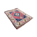 SHIRVAN CAUCASIAN EMBOSSED RUG, with large centre medallion with stepped sides and diamond shaped