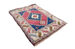 SHIRVAN CAUCASIAN EMBOSSED RUG, with large centre medallion with stepped sides and diamond shaped