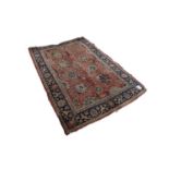 SEMI ANTIQUE KASHAN RUG, with an all-over design of delicate foliate scrolls with large formal