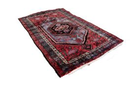 GOREVAN, PERSIAN, SMALL CARPET with large concentric hexagonal medallions, with arrow pattern