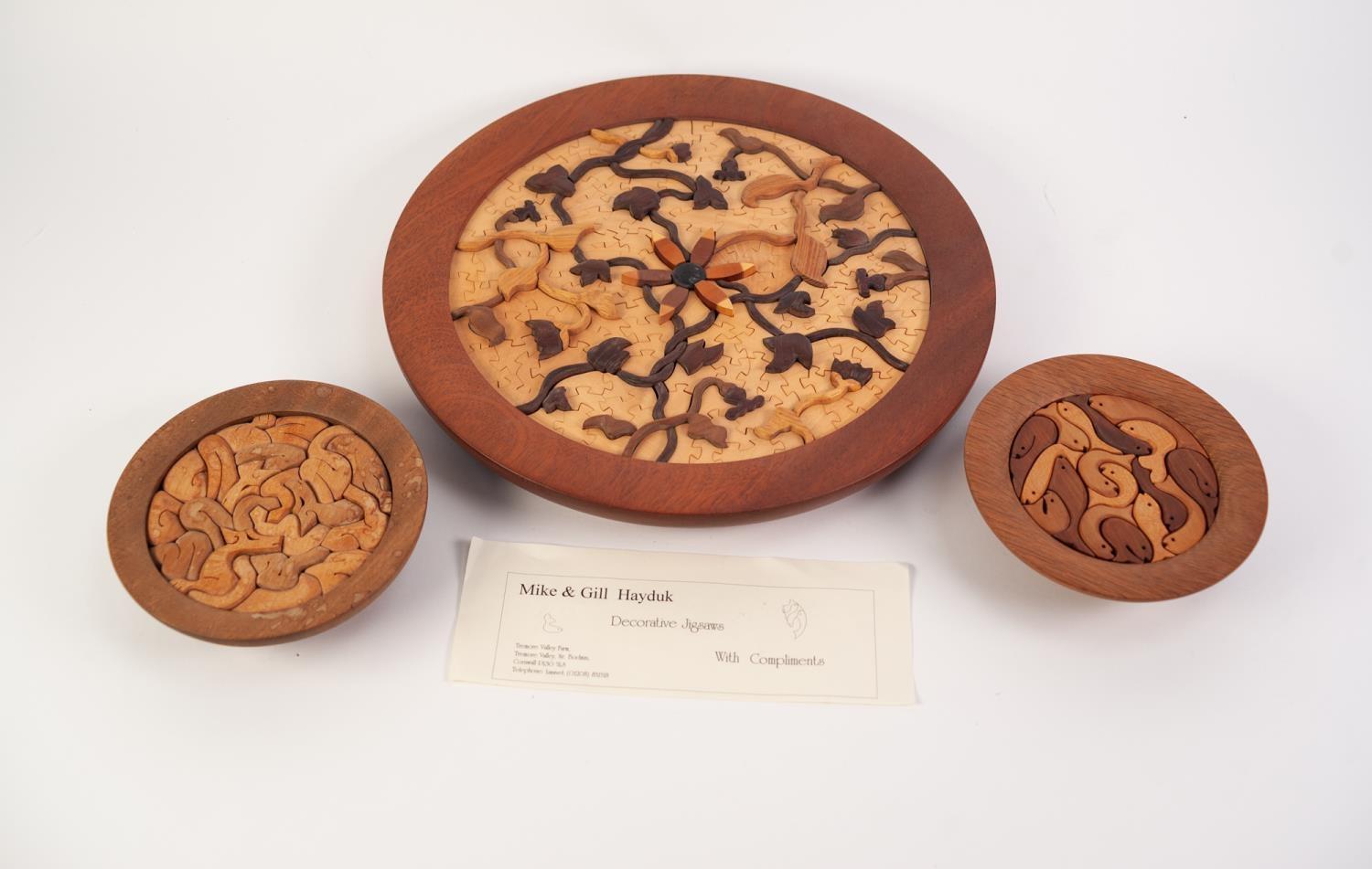 THREE MIKE & GILL HAYDUK FRET CUT WOODEN CIRCULAR ?DECORATIVE JIGSAWS?, comprising: one of floral