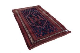 SEMI-ANTIQUE SHIRAZ PERSIAN RUG WITH MID-NIGH BLUE FIELD, with hexagonal central panel enclosed by a