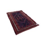 SEMI-ANTIQUE SHIRAZ PERSIAN RUG WITH MID-NIGH BLUE FIELD, with hexagonal central panel enclosed by a