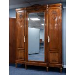 FIVE PIECE EARLY TWENTIETH CENTURY FRENCH CARVED WALNUT BEDROOM SUITE, comprising: THREE DOOR