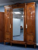 FIVE PIECE EARLY TWENTIETH CENTURY FRENCH CARVED WALNUT BEDROOM SUITE, comprising: THREE DOOR