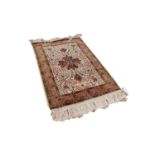 KERMANSHAH FINELY KNOTTED PERSIAN RUG, the central quatrefoil medallion pale blue and dark wine red,