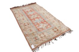 MODERN EMBOSSED SAMARKAND PASTEL COLOURED RUG, with a row of diamond shaped medallions on the narrow