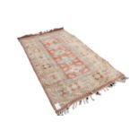 MODERN EMBOSSED SAMARKAND PASTEL COLOURED RUG, with a row of diamond shaped medallions on the narrow