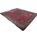 LARGE, POSSIBLY EUROPEAN, PERSIAN STYLE CARPET, having a rose pink field, large green, brown and
