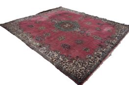 LARGE, POSSIBLY EUROPEAN, PERSIAN STYLE CARPET, having a rose pink field, large green, brown and