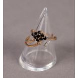 9ct GOLD RING, the three strand top set with three tiny white stones (fourth strand missing) and a