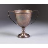 SILVER TWO HANDLED SMALL PEDESTAL TROPHY CUP, with angular scroll handles, 4? (10.2cm) high,