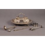 ELECTROPLATED OVAL DESK STAND, housing a pair of square cut glass ink bottles with embossed