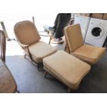 AN ERCOL ELM ARMCHAIR, WITH BEIGE CUSHIONS AND MATCHING FOOTSTOOL (2)