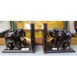 A PAIR OF EBONY ELEPHANT BOOKENDS