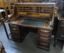 AN ANTIQUE OAK ROLL TOP DESK, WITH FOUR DRAWERS TO EACH PEDESTAL, THE ROLL-TOP SECTION COVERING