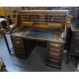 AN ANTIQUE OAK ROLL TOP DESK, WITH FOUR DRAWERS TO EACH PEDESTAL, THE ROLL-TOP SECTION COVERING