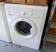 AN INDESIT AUTOMATIC WASHING MACHINE