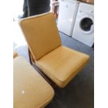 AN ERCOL ELM ARMLESS LOUNGE CHAIR WITH BEIGE CUSHION