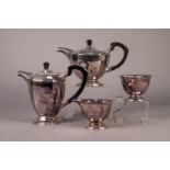 ASHBERRY FOUR PIECE ELECTROPLATED TEASET, of circular, panelled form with black scroll handles and