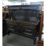 A CARVED OAK DRESSER SIDEBOARD OF JACOBEAN STYLE WITH HIGH CANOPY BACK, TWO DRAWERS OVER TWO