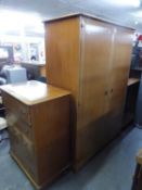 A STAG LIGHTWOOD TWO DOOR WARDROBE AND A CHEST OF FOUR LONG DRAWERS WITH A ROW OF THREE SMALL