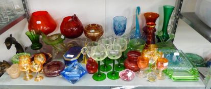 A SELECTION OF COLOURED GLASSWARES TO INCLUDE; A SET OF SIX GREEN STEM WINE GLASSES, A QUANTITY OF