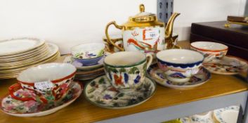 VIETNAMESE TEAPOT, 4 CUPS AND STAND AND FIVE CHINA CUPS AND SAUCERS