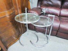 A PAIR OF TUBULAR BRIGHT METAL OCCASIONAL TABLES, WITH PLATE GLASS TOPS